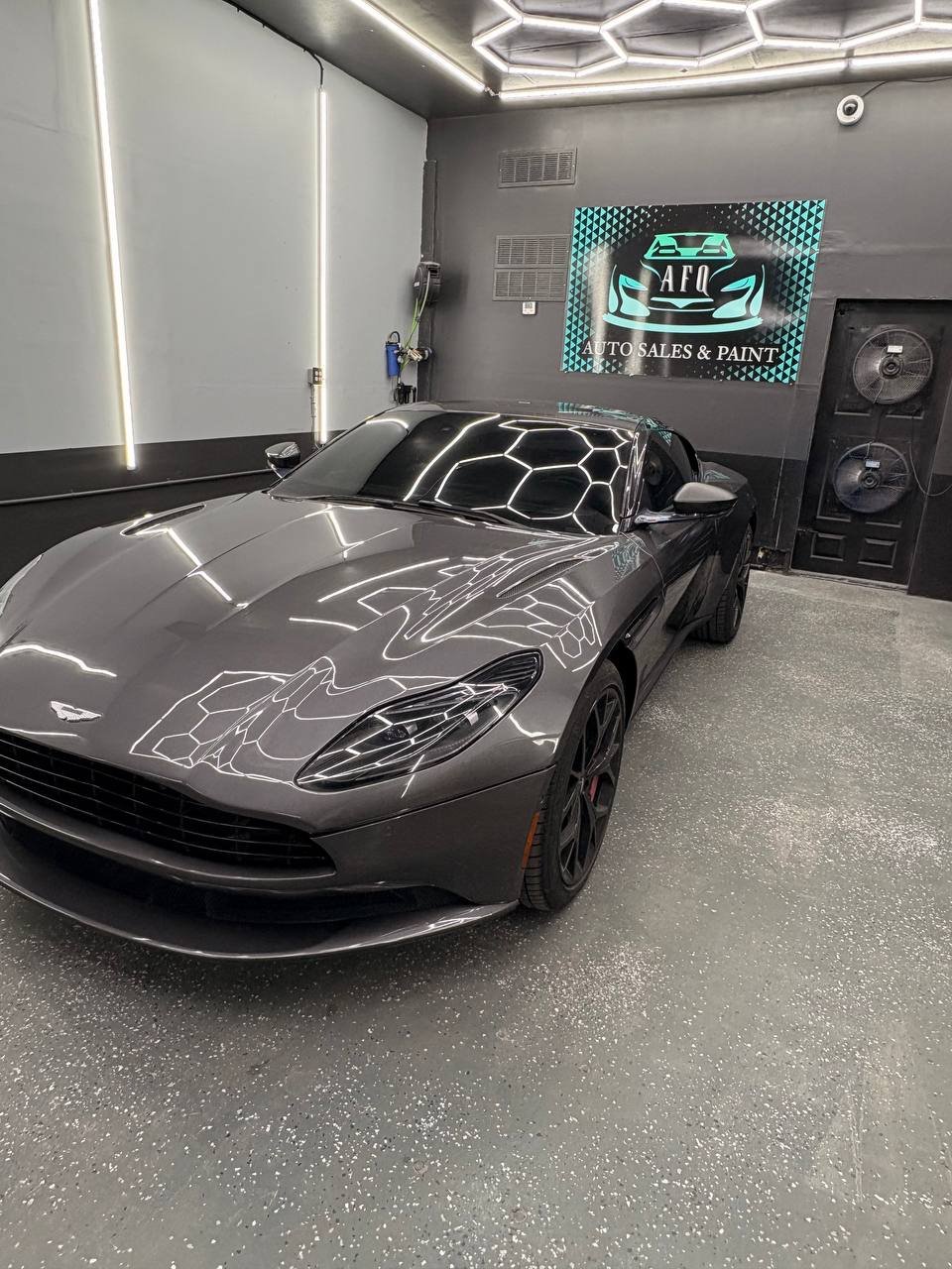 Gray sports car after professional refinishing work at AFQ Auto Sales and Paint